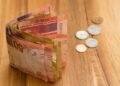 Rand weakens against stronger dollar; focus on mid-term budget