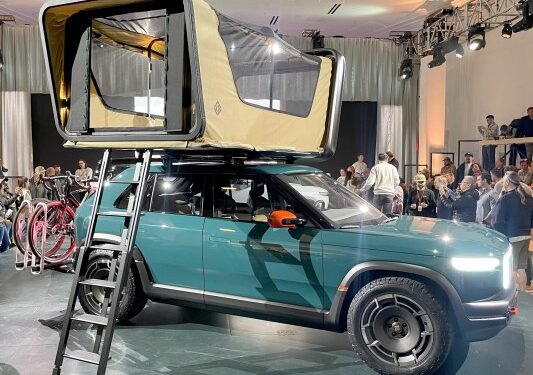 Rivian’s new ‘treehouse’ rooftop tent comes with a movie projector