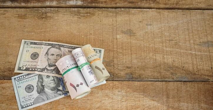 US consumer spending rises in November; monthly inflation subsides