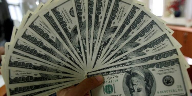 Dollar drops but maintains modest weekly gains