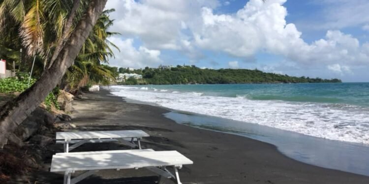 This Beach Town Is a Laid-Back Getaway With a Famous Rock, Wild Waves, and French Caribbean Charm