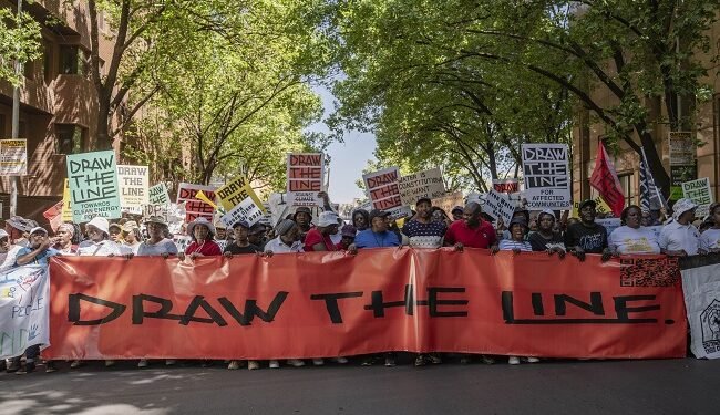 Thousands take to the streets worldwide to ‘Draw the Line’ for climate justice – EnviroNews