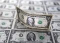 Dollar hovers near five-week low on Fed rate cut bets