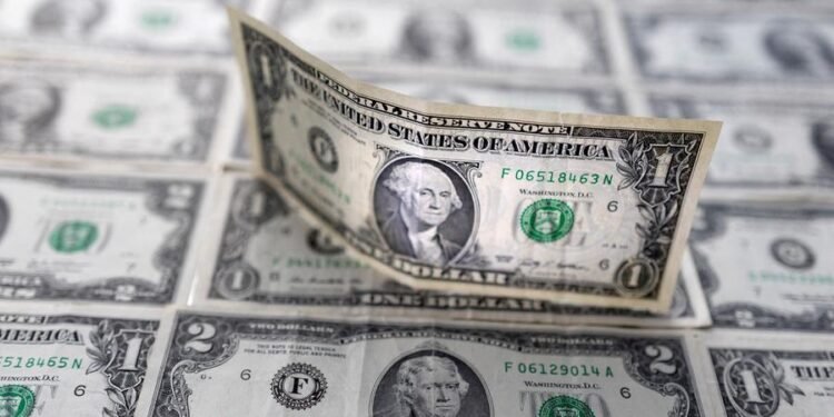 Dollar hovers near five-week low on Fed rate cut bets