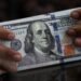 Dollar meanders as traders await key US economic data